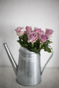 Close-up of rose flower vase on table
