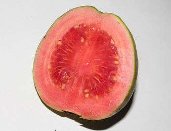 Close-up of strawberry over white background