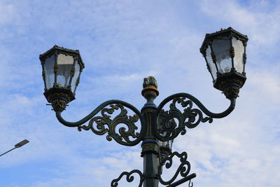 Vintage iron street lamp with blue sky on clear day