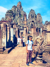 Full length of women standing in front of historical building