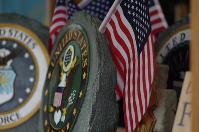 Close-up of flags against wall