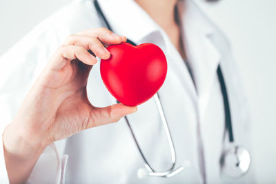 Close-up of hand holding red heart