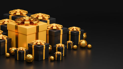 Close-up of cake on table against black background