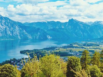 Scenic view of trees and mountains against sky