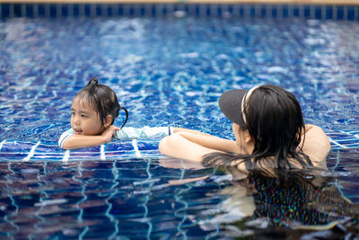 Portrait of a girl swimming in pool