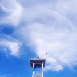 Low angle view of tower against cloudy sky