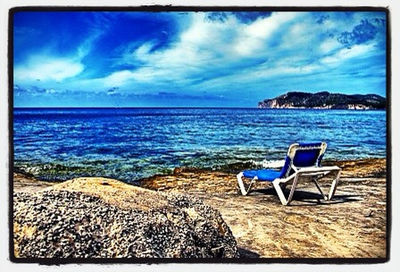 Scenic view of sea against cloudy sky