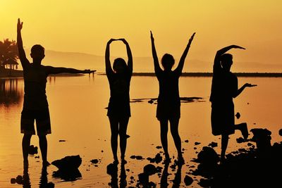 People enjoying at sunset