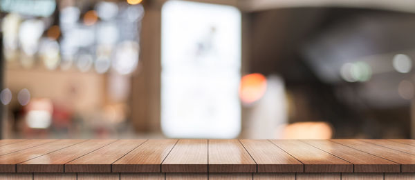 Close-up of wooden table in cafe