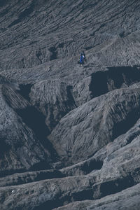 High angle view of people on mountain against sky