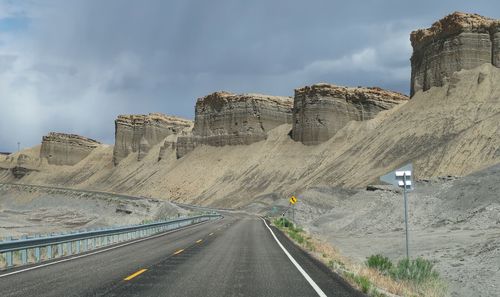 Bizarre grey rounded stone formations along a road in utah