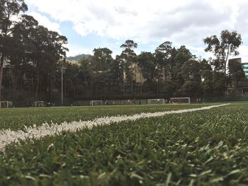 Scenic view of soccer field against sky