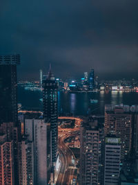 High angle view of illuminated buildings in city at night