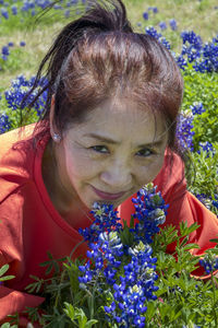 Portrait of girl with purple flowering plants