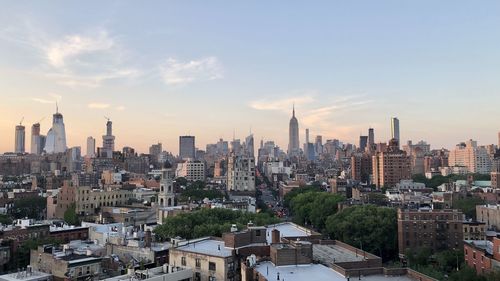 High angle view of city buildings against sky