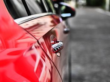 Close-up of vintage car on road