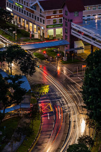 High angle view of light trails on road at night