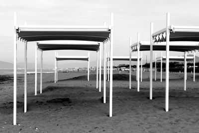 Tents at beach against sky