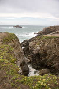 Scenic view of sea against cloudy sky