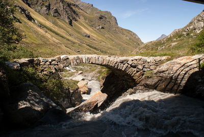 Scenic view of mountains and bridge