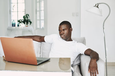 Portrait of young man using mobile phone