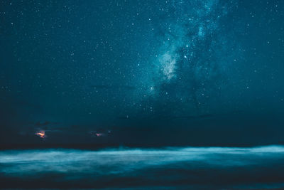 Scenic view of sea against sky at night