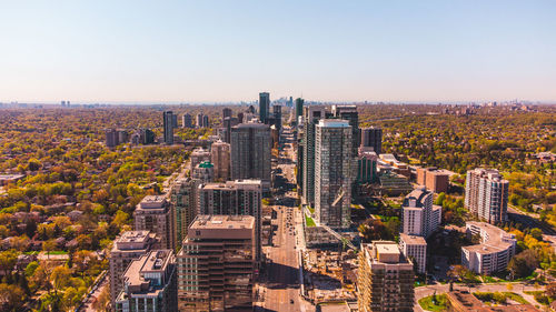 High angle view of buildings in city against clear sky