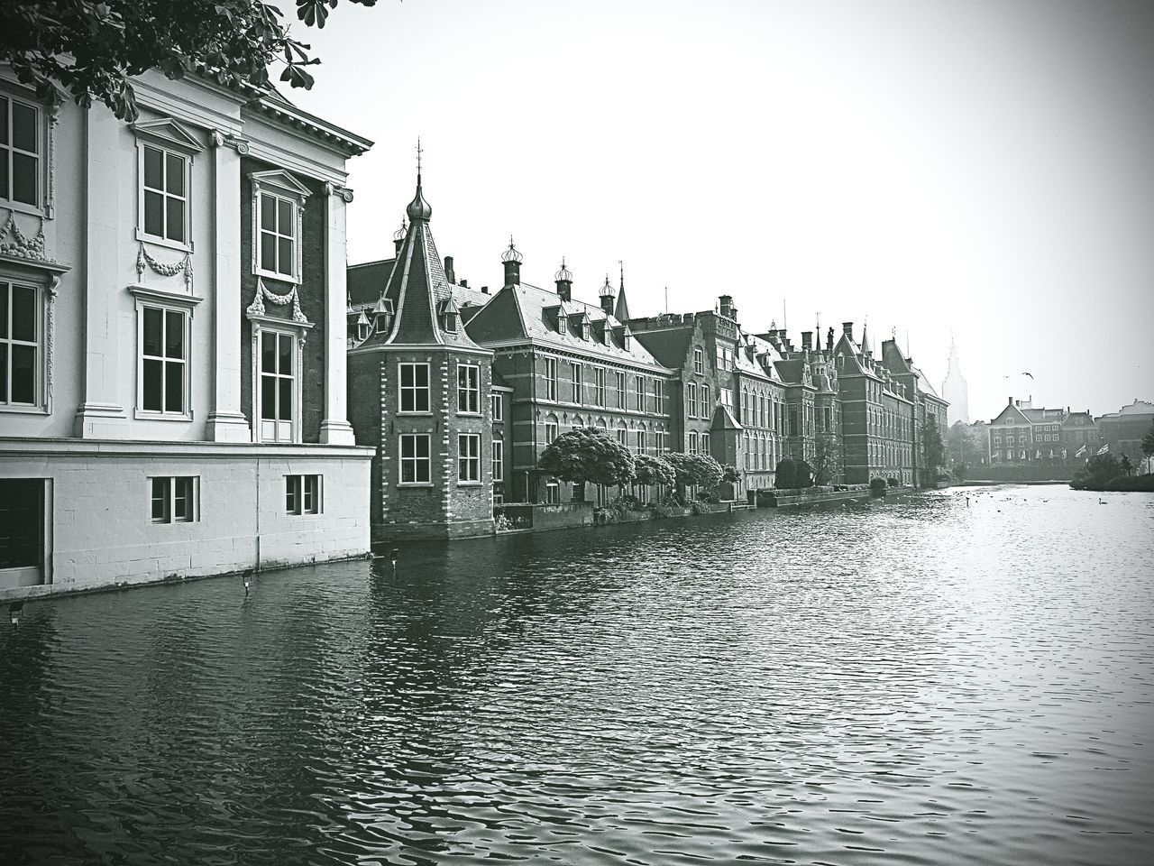 VIEW OF BUILDINGS BY RIVER