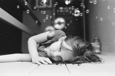 Girl lying on floor at home
