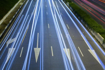 High angle view of light trails on highway