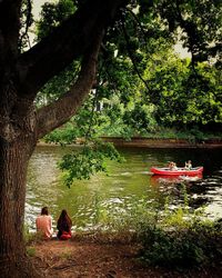 People relaxing on lake