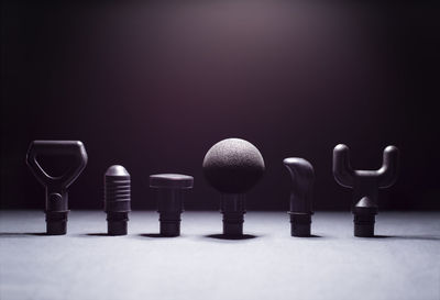 Close-up of objects on table against black background