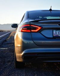 Cropped image of car on road