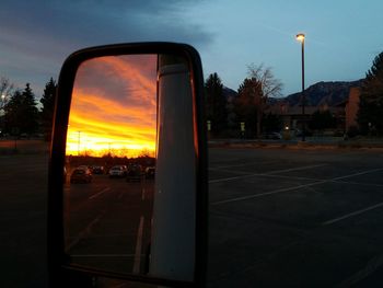 Road against cloudy sky at sunset