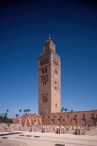 Koutoubia mosque minaret in morocco marrakesh and gardens during sunset with blue sky. inside