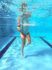 Full length of man swimming in pool