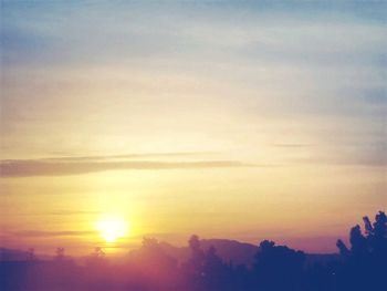 Scenic view of silhouette landscape against sky during sunset