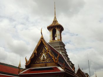 Low angle view of temple building against cloudy sky