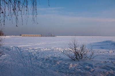Scenic view of snow covered frozen sea against sky