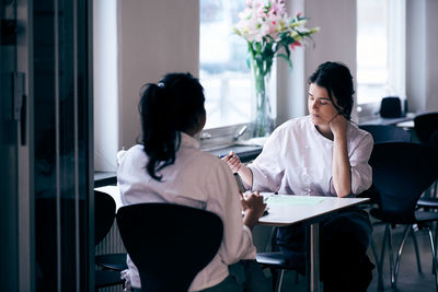 Chefs discussing menu in restaurant