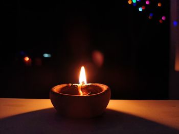 Close-up of illuminated tea light candles