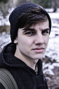 Portrait of man on field during winter