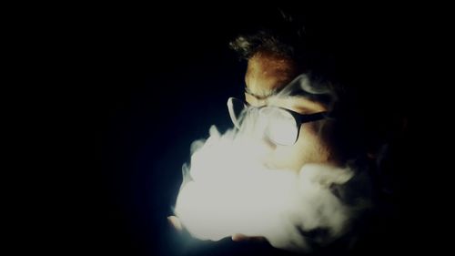 Close-up of fire over black background