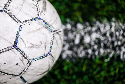 Close-up of soccer ball on field