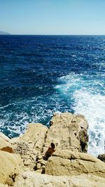 Scenic view of sea against clear blue sky