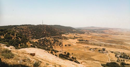 Scenic view of arid landscape against clear sky