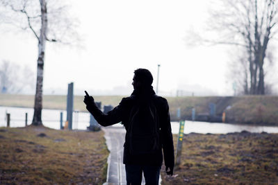Rear view of a woman standing in winter