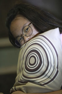 Portrait of girl holding pillow