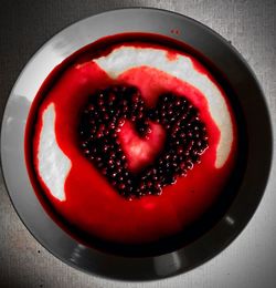 Directly above shot of red heart shape on table