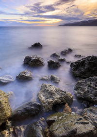 Scenic view of sea against sky at sunset